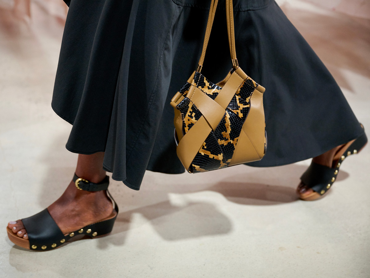 women walking with bag